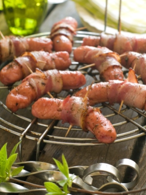 Grilled sausage wrapped in bacon