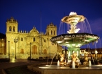 A fountain in Plaza de Armas with Cathedral,Night view