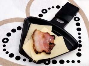 Raclette pan with cheese and bacon