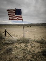 Monument Valley landscape withn an American flag